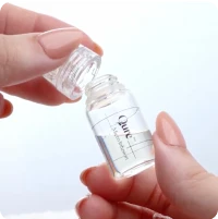 Qure serum bottle being opened