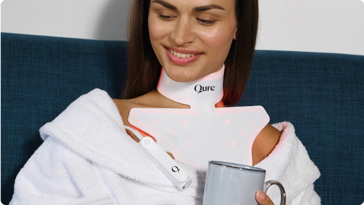 Woman using Qure anti-aging device