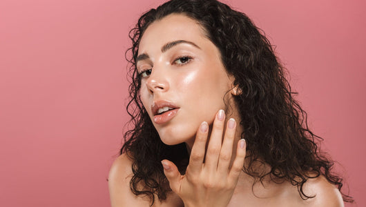 Woman with clear, glowing skin, the kind of result people look for when comparing the qure vs solawave mask