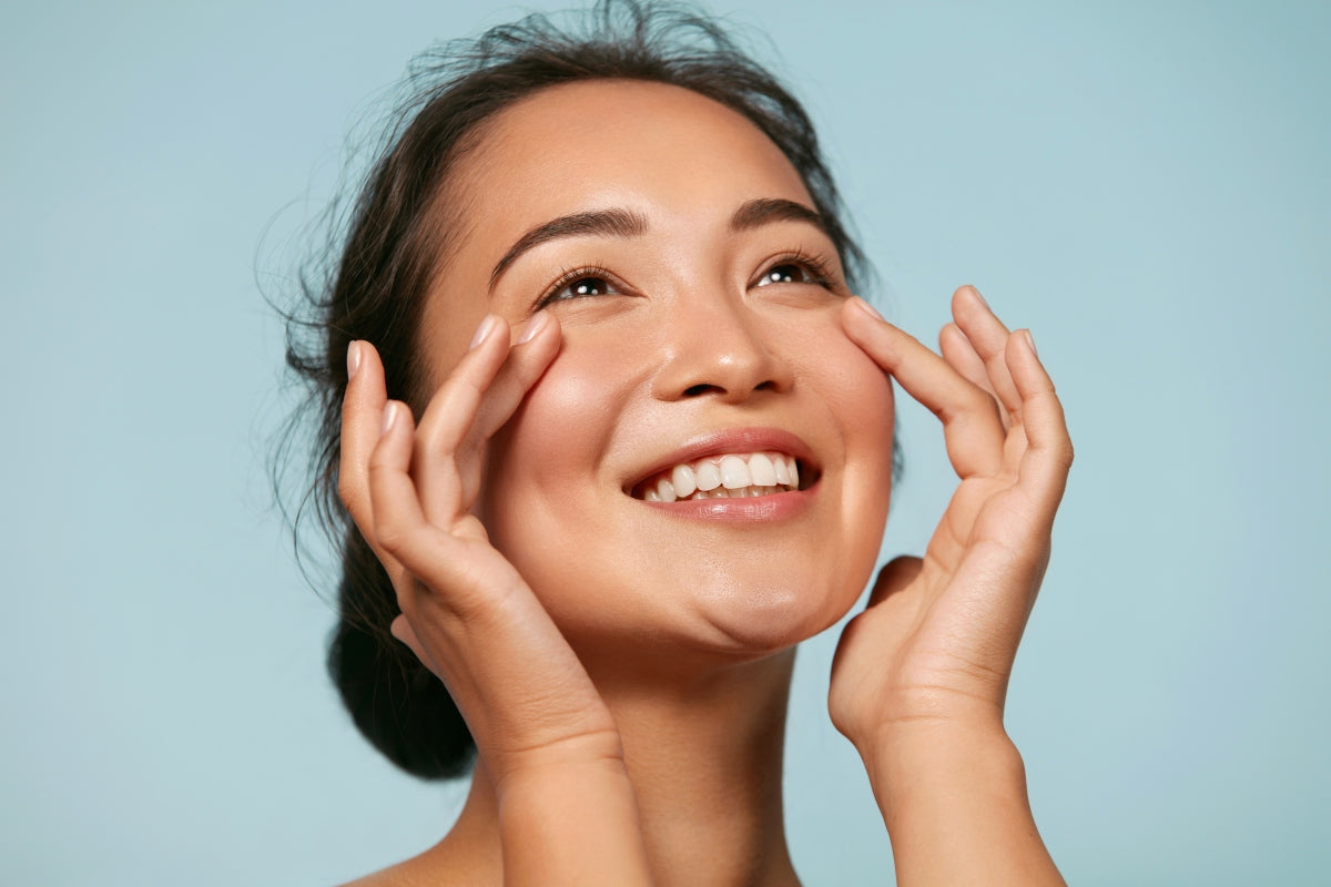 Woman with glowing, healthy-looking skin comparing qure led mask vs currentbody