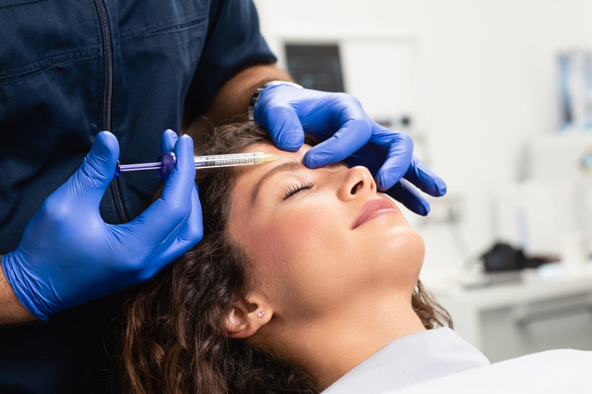 Women getting Botox injection while considering red light therapy after Botox.