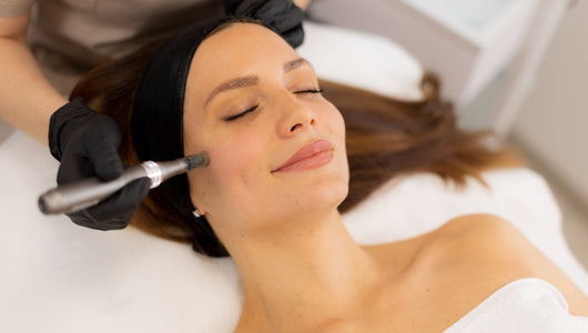 Gloved esthetician performing a facial treatment