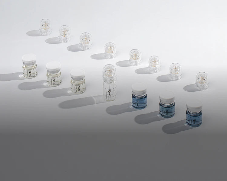 Array of vials on white background
